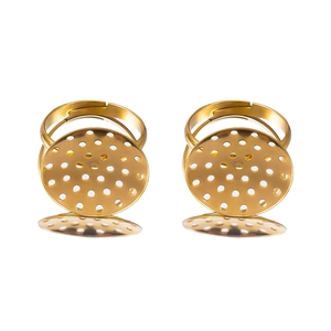 Macro detail of adjustable gold DIY ring base with perforated circular disk for jewelry making