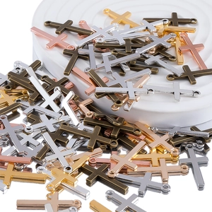 Detailed view of DIY alloy cross pendants in silver, gold, rose gold and bronze finishes