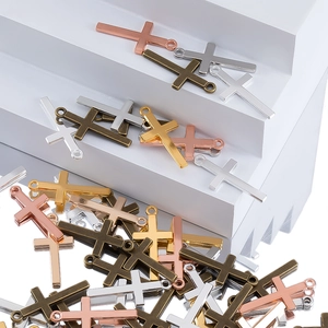 Detail view of four-color cross pendants with closed loops for DIY jewelry making