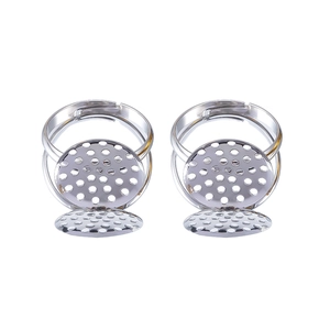 Close-up of adjustable silver DIY ring blanks with round multi-hole sieve base for jewelry