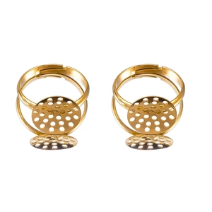 Detail of adjustable gold-plated ring bases with mesh pads for DIY jewelry making