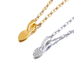 Vintage mini shovel pendant necklaces in gold and silver with textured water wave chains
