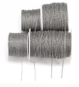 Macro shot of four spools with various silver stainless steel DIY jewelry chains