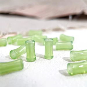 Translucent light green bamboo-shaped glass beads for DIY handcrafted jewelry making