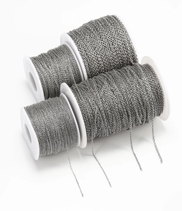 Close-up of four rolls of stainless steel DIY jewelry chains for necklaces and bracelets