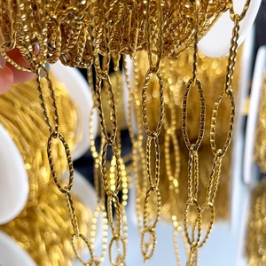 Close-up of gold stainless steel diamond-pattern embossed oval link chain for DIY jewelry