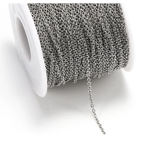 Macro shot of silver-plated O-link chain spool for DIY jewelry making and necklace crafts