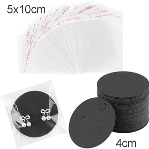Detail of black earring display cards with clear plastic packaging bags and bow studs