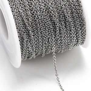 Silver stainless steel cross chain on a white spool for DIY jewelry making and necklaces