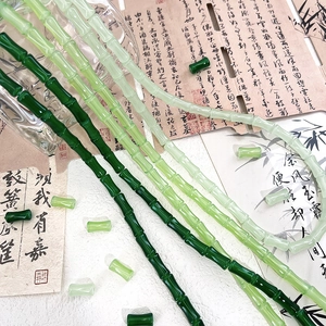 Detail of bamboo joint glass beads in gradient green for DIY jewelry making and crafts