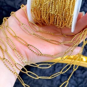 Close-up of golden diamond-cut textured chain links for DIY jewelry making