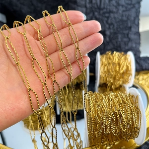 Macro shot of gold-plated textured paperclip chain links for DIY jewelry making