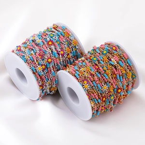 Detail of colorful daisy seed bead chains on spools for DIY jewelry making