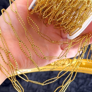 Detailed macro view of textured gold diamond-shaped link chain for DIY jewelry making