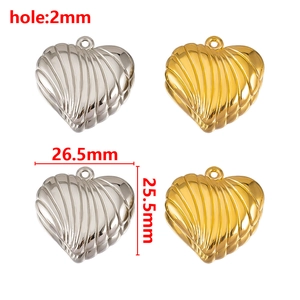 Macro view showing dimensions of heart-shaped metal charms with ribbed texture