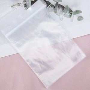 Close-up of clear resealable plastic bags with zipper lock on decorative background