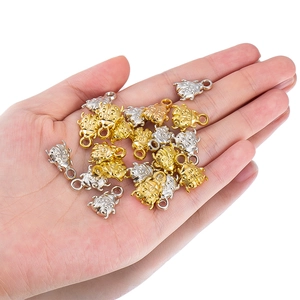 Macro detail of ladybug charms in gold and silver plating for DIY jewelry making