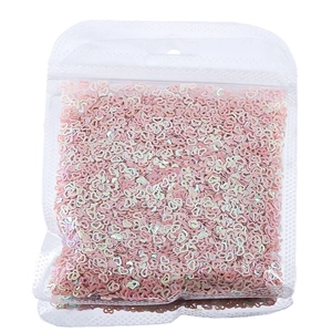 Dettaglio delle paillettes olografiche rosa a forma di cuore per nail art in sacchetto