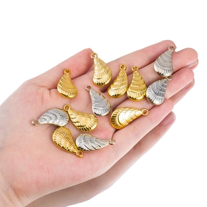 Detailed view of teardrop metallic pendants in gold and silver for DIY jewelry making