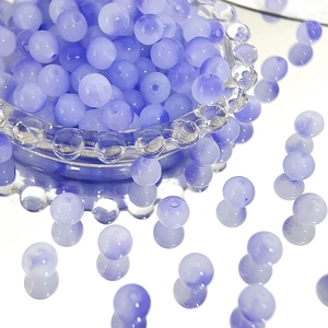 Detail of 8mm lilac two-tone gradient Czech glass beads with hole for jewelry making