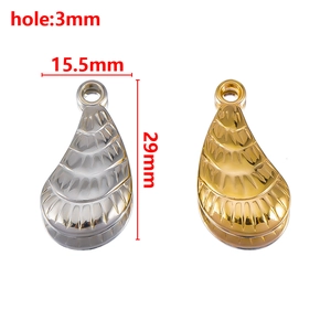 Detail view of 29mm metallic teardrop charms in gold and silver with size dimensions