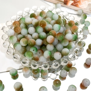 Macro shot of 8mm gradient glass beads with marble texture for jewelry making