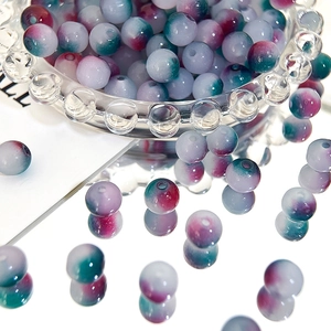 Close-up of 8mm gradient Czech beads in a glass bowl with sharp purple and green tones