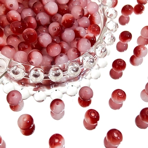 Macro shot of 8mm two-tone gradient Czech glass beads for DIY jewelry making