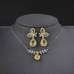Sparkling yellow pear-cut zircon necklace and wing-style earring jewelry set