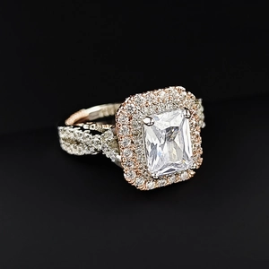 Luxurious two-tone halo engagement ring with princess cut diamond and twisted band