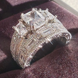 Detailed view of square cut moonstone ring with milgrain edge and shimmering pavé diamonds