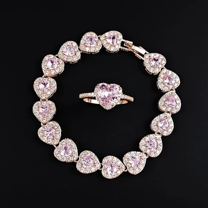 Rose gold jewelry set with pink heart gems and pavé diamonds, bracelet and ring