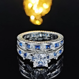 Macro shot of S925 silver ring set featuring square blue and white zirconia stones