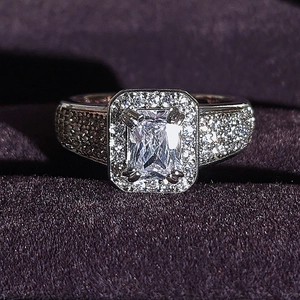 Elegant silver engagement ring with rectangular crystal and pavé set accent stones