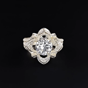 Detailed top view of a zircon rose ring featuring intricate vintage hollow metalwork