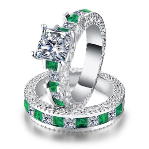 Luxury princess cut cubic zirconia ring set with green gemstones and engraved silver band