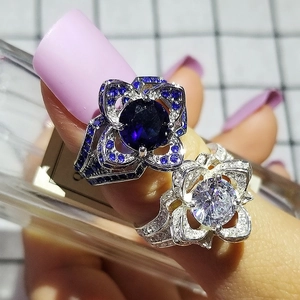 Elegant floral zircon rings with deep blue and white stones in a vintage pave setting
