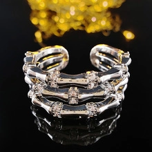 Macro shot of silver tiered bamboo ring with pavé marquise cubic zirconia detail