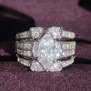 Elegant silver marquise cut ring set with layered pavé diamond bands and velvet box