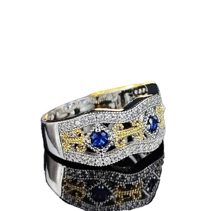 Vintage wide band ring with blue sapphire stones and golden filigree wave pattern