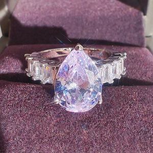 Elegant pear cut teardrop ring with pavé rectangle zircon stones in a luxury velvet gift box
