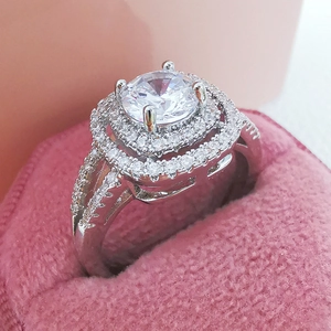 Luxurious double halo cubic zirconia ring on a pink velvet box for women