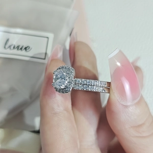Elegant halo style silver ring set with round crystal stones for engagement and romance