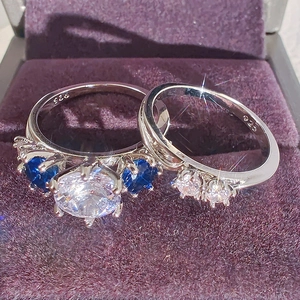 Juego de anillos de boda de plata 925 con zafiro azul y circonita blanca central