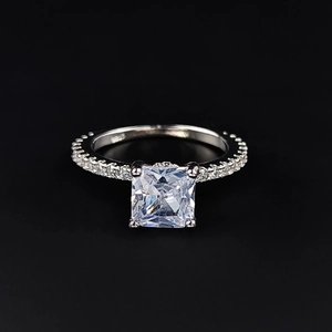 Classic silver ring featuring a large square-cut diamond and pave-set accents on black