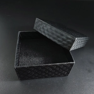 Classic black square jewelry box with diamond pattern texture and protective velvet lining