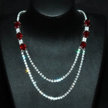 Detail of luxury double-layered necklace with red teardrop stones and sparkling crystals