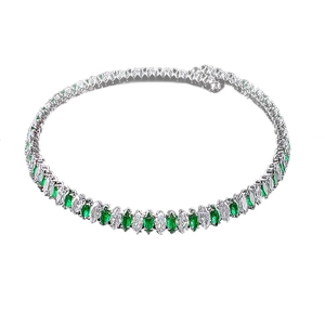 Close-up of emerald and white marquise cut crystals on a silver chain necklace