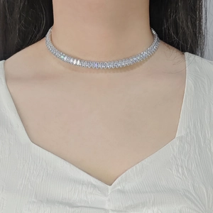 Elegant emerald marquise-cut crystal necklace showcased on a female model for a luxury look