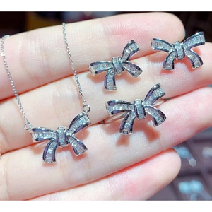 Silver bow jewelry set with baguette zircon necklace, ring, and earrings for women
